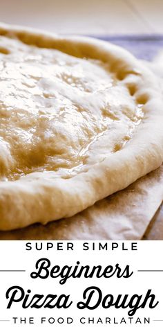 a homemade pizza dough sitting on top of a table