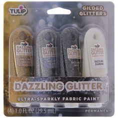 three glitter bottles in the packaging