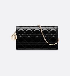 The Lady Dior pouch with chain, crafted in black patent calfskin, is distinguished by the emblematic Cannage topstitching and detachable D.I.O.R. charms. The unique accessory may be worn with or without its chain strap and features two removable elements: a card holder and a zipped pouch. Each may be carried individually. The pouch will instantly stand out and pairs well with other pieces from the same line.. Lady Dior Pouch, Dior Pouch, Dior Clutch, Dior Handbags, The Lady, The Pouch, Lady Dior, Pouch Bag, Baby Bag