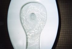 the toilet seat is covered with white powder