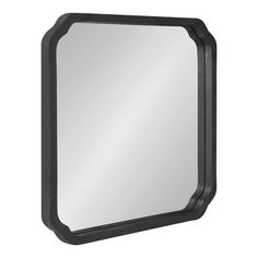 a mirror that is black and has a small frame around it's edges on the wall