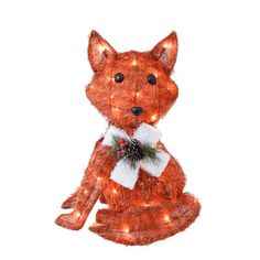 an orange stuffed animal with christmas lights around it's neck