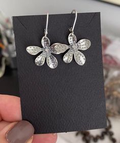 "Sterling silver flower dangle earrings are finished with sterling silver lever backs for a secure wear.  These earrings make a sweet gift for a nature lover, gardener or a special girl on any occasion. The earrings measure approx 1.5\" from end to end and are approx 1\" wide. You may also like to check out more of my earrings here: http://etsy.me/2oDJlWy Free USPS First Class shipping within the USA." Flower Dangle Earrings, Botanical Earrings, Botanical Jewelry, Special Girl, Silver Dangle Earrings, Handmade Jewelry Gift, Sterling Silver Dangle Earrings, Sterling Silver Flowers, Floral Jewellery