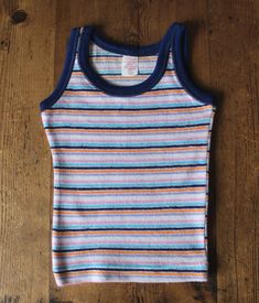 Vintage 70/80's, very cute little summer tank, striped terrycloth jersey, ( acrylic and nylon ) made in Spain.. Size 1 year Vintage condition level 5, new old stock  We assess the condition of our vintage items on a scale from 0 to 5. Level 5 corresponds to an almost new vintage condition. Any defects are systematically reported. Even though in very good condition, vintage items may present imperfections due to their age, which mainly adds to their charm. I am fond of children wearing vintage clothes  They definetely look so cute   Vintage clothes are original, trendy, and often better manufactured than actual production ... It is also an opportunity for optimal recycling and a great way not to add to mass overproduction, don't you think so ? Thank you for your visit Summer Striped Cotton Vest, Striped Cotton Sleeveless Tank Top, Striped Tops For Summer Playtime, Multicolor Sleeveless Tops For Playtime, Summer Tank, 80s Outfit, Terry Cloth, New Vintage, Fitness Inspo