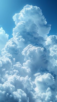 an airplane is flying high in the sky with many fluffy clouds above it and blue skies below