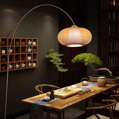 a room with a table, chairs and a potted plant on top of it