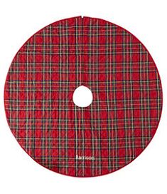 a red and black plaid cloth on a white background with a hole in the center