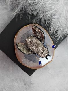 "Beautiful dark purple beetle brooch (cicada brooch) is lovely handmade by me. 💓 This beautiful hand embroidered beetle brooch (cicada brooch) took hours of precision and elaborate embroidery work. This cicada brooch will be a wonderful gift to a very special person! SIZE Size: 5,5 cm (2,16\") (without legs) MATERIALS Made of czech, japanese seed beads, glass crystals and sequins. Beaded jewelry requires careful and loving care. Avoid contact with hairspray, perfume, water, bleaches & lotio Handmade Artisan Brooches For Gift, Artisan Handmade Brooches For Jewelry Making, Unique Embroidered Brooch For Gift, Unique Embroidered Brooches For Gifts, Silver Embellished Brooches For Gift, Handmade Unique Brooches For Crafting, Bohemian Handmade Pins As Gift, Unique Handmade Wedding Pins, Embroidered Beetle