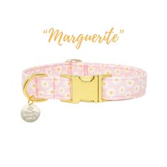 a pink collar with daisies on it and the words, marquette written in gold