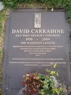 a plaque in the grass that reads david carradine