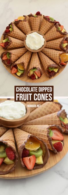 chocolate dipped fruit cones with whipped cream and strawberries in them on a wooden platter