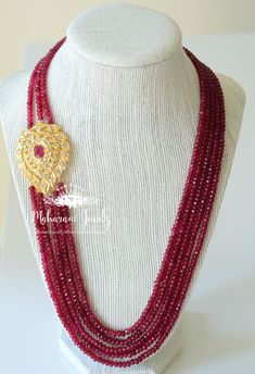 Gorgeous High Quality faux rubies stranded together with a one of a kind handmade, gold plated side pendant. Matching Earrings are available upon request for an extra charge. Earrings are approximately two inches with push backs. Necklace length is adjustable. Also available in real rubies and faux emeralds. Gold Kundan Necklace With Faceted Beads As Gift, Festive Ruby Gemstone Bead Jewelry, Gold Ruby Gemstone Beads Jewelry, Gold Ruby Beaded Necklaces With Gemstone Beads, Festive Ruby Gemstone Beads Jewelry, Gold Ruby Single Strand Jewelry, Traditional Red Single Strand Necklace, Festive Gold Ruby Beaded Necklaces, Multi-strand Faceted Beads Jewelry For Wedding