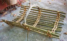 several pieces of bamboo sitting on the ground