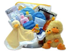 In the Bath Time Baby gift basket, the Plush Momma duck is followed by the baby ducks. Cozy bath accessories include a hooded bath towel, a baby picture frame, and an ultra soft Duckling  blanket.  Send the Bath Time Baby gift, available in 2 sizes, to your favorite bath time baby! (Available in Blue, Yellow and Pink). Includes: Baby Wash Tub (12" round), 7 oz. Johnson & Johnson Tearless Baby Shampoo, 12" Momma Duck and 3" baby duck, Ultra plush baby duck security blanket, a 100% Cotton Tee Shir Baby Picture Frame, Thoughtful Baby Gifts, Baby Boy Gift Baskets, Cozy Bath, Baby Hooded Bath Towel, Baby Picture Frames, Baby Bath Towel, Baby Bath Time, Baby Baskets