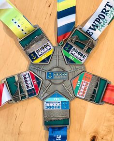 several medals are arranged in the shape of a star on top of a wooden table