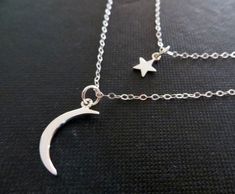 Moon and star necklace. sterling silver double chain and dainty charms. Inner chain measures 16'' and comes with 2'' extender. all findings are sterling silver. tiny star charm-12x6mm crescent moon charm-21x8mm Celestial Silver Charm Necklaces With Delicate Chain, Celestial Silver Charm Necklace With Delicate Chain, Silver Layered Moon Charm Necklace For Gift, Silver Layered Necklace With Moon Charm As A Gift, Silver Layered Necklace With Moon Charm For Gift, Silver Dainty Charm Necklace With Double Chain, Silver Dainty Double Chain Charm Necklace, Dainty Silver Charm Necklace With Double Chain, Dainty Silver Double Chain Charm Necklace