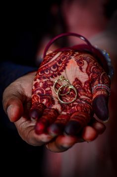 a woman holding out her hand with a ring on it