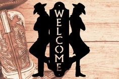 A welcome sign with a cowboy and cowgirl duo Herding Dogs Breeds, Boxer Bulldog, Dog Leash Holder, Monogram Art, Medal Hanger, Terrier Breeds, Herding Dogs, Name Plaques, Sporting Dogs