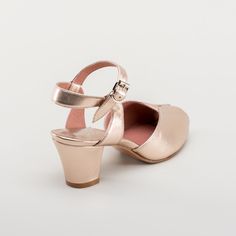 If you're looking for the perfect vintage sandal, look no further than Lido. These pretty and practical shoes are closely based on an original late 1940s to early 1950s sandal in our collection. The design is perfectly balanced, made in a luminous metallic leather, with secure buckle straps and a tiny peep toe, making the Lidos perfect for dancing, walking, and lounging. Built on our new 2.5 inch / 5.7 cm reproduction Cuban heel, the Lidos are soft and springy. Wear them for all occasions from t Practical Shoes, American Duchess, Vintage Sandals, Cuban Heels, Pig Skin, Metallic Leather, Leather Cover, Cute Designs, Leather Heels