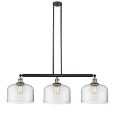 three light chandelier with glass shades on the bottom and two lights above it