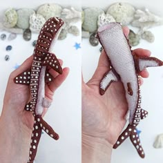 two pictures of a hand holding a stuffed toy shark in the shape of a fish