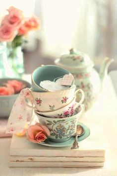 a stack of tea cups sitting on top of a table