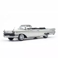 an old model white car on a white background