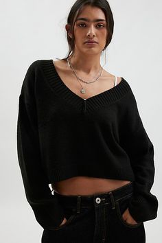 Forever staple BDG sweater in an effortless pullover sweater style. Designed in a boxy & cropped fit featuring a wide v-neckline and drop shoulders for a slouchy look. Finished with ribbed knit trim. Find it only at Urban Outfitters. Features BDG Jenna cropped v-neck sweater Slouchy oversized sweater Soft and stretchy knit Wide v-neckline and long sleeves with ribbed knit trim Ribbed knit hem Boxy, relaxed fit Cropped length Easy pullover style UO exclusive Contents + Care 53% Recycled polyester Black Knitted V-neck Sweater, Black Trendy V-neck Sweater, V Neck Cable Knit Sweater, Black Cable Knit V-neck Sweater, Urban Outfitters V-neck Sweater, Cable Knit Sweater Outfit, Black Cropped Sweater, Black V Neck Sweater, Stretch Black V-neck Sweater