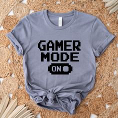 Gamer Mode On Shirt, Gamer Console Gift Tee, Gamer T Shirt, Dad Game Shirt, Game Boy Tee, Gift For Game Lover, Gamer Party Vibe Shirt Please review all the sizing charts that were added in the product pictures. Reading the Sizing Chart: Please note that the sizing chart includes the measurements of one side of the shirt, not the circumference. Solid colors are all cotton and heather colors are cotton/poly blend. (there may be exceptions). Different styles of shirts may have different shades of s Gamer Style Short Sleeve Tops With Funny Text, Gamer Style Short Sleeve Top With Letter Print, Gamer Graphic Print Short Sleeve Tops, Gamer Crew Neck Top With Letter Print, Gamer Tops With Letter Print And Crew Neck, Gamer Cotton Top With Graphic Print, Gamer Party, Party Vibe, Gamer T Shirt