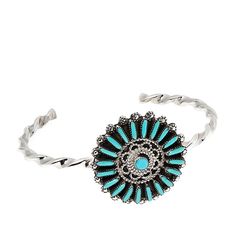 Chaco Canyon Sterling Silver Turquoise Zuni Flower Cuff Vibrant Kingman turquoise forms the petals of this pretty cuff. Worn solo or stacked, it's a fresh pick for your jewelry collection.        Approx. 6"L x 1-1/4"W; fits 5-1/4" to 6" wrist     Stamped .925 sterling silver; oxidized finish     Designed and Crafted in the USA   Stone Information       All sizes and weights approximate     Stabilized Kingman Turquoise - Round (4mm), rectangular (1x5mm to 1x6mm) Spring Turquoise Bracelet Jewelry, Spring Turquoise Jewelry Bracelet, Bohemian Turquoise Bracelet For Spring, Bohemian Turquoise Bracelets For Spring, Spring Bohemian Turquoise Jewelry, Chaco Canyon, Flower Cuff, Southwest Jewelry, Kingman Turquoise