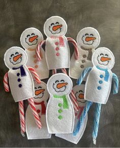 snowmen made out of toilet paper and candy canes