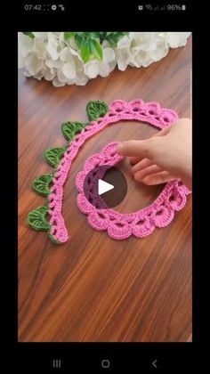 the video shows how to make crochet bracelets with flowers and leaves on them