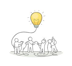 a group of people standing around a light bulb