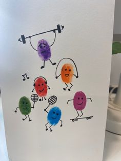 a card with different colored cartoon characters on it