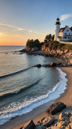 a lighthouse on top of a cliff next to the ocean with waves crashing in front of it