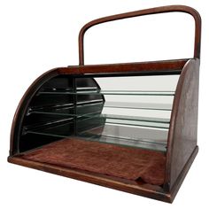 an old wooden display case with glass shelves