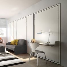 a living room filled with furniture and white walls