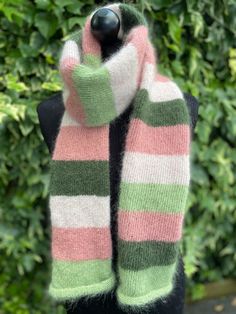 Hand knitted mohair and silk tube scarf in apple and dark green and heather and light pink stripes. This tube scarf is double sided showing only the right side of the knit.  Suitable for colder months as mohair is very warm. Knitted in double yarn for extra thickness, very light and extremely soft.  All my scarves are hand knitted by myself in Wales, UK, using sustainable natural fibers.  Wrapped and supplied with non plastic materials. Measurements: Scarf is shown on dummy size 8 (UK size). Len Knitted Tube Scarf, Wales Uk, Striped Scarf, Tube Scarf, Green Scarf, Pink Scarves, Striped Scarves, Double Face, Pink Stripes