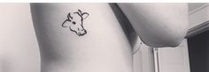 a black and white photo of a cow tattoo