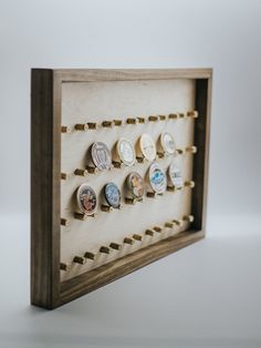 a wooden frame with several different types of watches on it