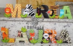 the letters are made out of paper and decorated with animals