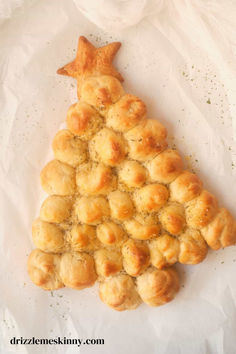 a christmas tree made out of biscuits on white paper