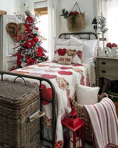 a bedroom decorated in red and white for christmas