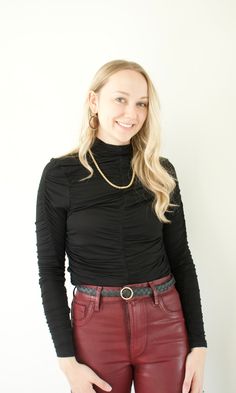 The Simone Turtleneck from Bishop + Young is a chic addition to any wardrobe. It is crafted from a soft, lightweight blend of 95% Rayon and 5% Spandex and features ruched detailing for an extra touch of style. It fits true to size, making it an easy and comfortable choice for any outfit. Fitted Tops With Ruched Sides For Fall, Chic High Neck Ruched Tops, Chic Ruched High Neck Tops, Chic Stretch Mock Neck Top For Fall, Chic Stretch Mock Neck Top For Layering, Chic Fitted Mock Neck Top For Fall, Chic Fitted Mock Neck Top, Chic Fitted Mock Neck Top For Layering, Chic Black Mock Neck Top For Spring