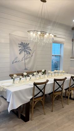 a dining room table set up with place settings