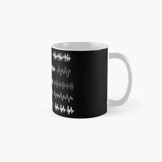 a black and white mug with sound waves on it