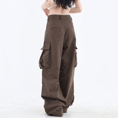 These classic-style brown pants feature a wide fit with cargo pockets Size: • S: Waist: 62cm/ 24.4 in, Length: 100cm/ 39.4 in• M: Waist: 66cm/ 26.0 in, Length: 101cm/ 39.8 in• L: Waist: 70cm/ 27.6 in, Length: 102cm/ 40.2 in• XL: Waist: 74cm/ 29.1 in, Length: 103cm/ 40.6 in• XXL: Waist: 80cm/ 31.5 in, Length: 104cm/ 40.9 inMaterial: Cotton, Polyester Brown Parachute Pants For Fall, High-waist Brown Parachute Pants For Fall, High Waist Brown Parachute Pants For Fall, Brown Bottoms With Side Pockets For Fall, Brown Full Length Cargo Pants, Full Length Brown Cargo Bottoms, Brown Full Length Cargo Bottoms, Brown Full-length Cargo Bottoms, Wide Leg Brown Pants For Streetwear