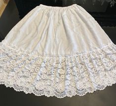 "Beautiful cotton comfortable skirt with wide lace hem, spring and summer skirt, beach skirt, elasticated waistband light weight fabric natural white colour. cool skirt Waist -24-28\"(S/M)Length 22\" Waist-30-34\"(M/L)Length 22\" Waist-36-38\"(L/XL) Length 22\" Waist-40-42\"(XL/XXL)Length 22\" Please check the waist size and the length before you order. please contact me if you have any problems with your Order Thank you" Lace Ruffled Skirt For The Beach, White Cotton Skirt With Attached Cancan, Lace Ruffled Skirt For Beach, Lace Ruffled Beach Skirt, White Cotton Skirt-shape Petticoat, Beach Skirt With Cotton Lace Trim, Beach Skirt With Lace Trim Cotton, Beach Skirt With Lace Trim In Cotton, White Cotton Petticoat Skirt