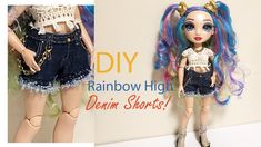 the doll is wearing denim shorts and has blue hair