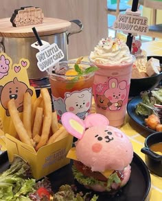 an assortment of food items displayed on plates and in bowls at a table with other foods